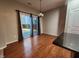Bright dining room with hardwood floors and sliding glass doors leading to backyard at 302 Glenview Ln, Durham, NC 27703