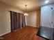 Hardwood floor dining room with chandelier and sliding glass door access at 302 Glenview Ln, Durham, NC 27703