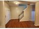 Hardwood floor entryway with staircase and interior door at 302 Glenview Ln, Durham, NC 27703