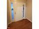 Front entry with hardwood floors and a white door at 302 Glenview Ln, Durham, NC 27703