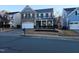 Two-story house with brick and siding, a two-car garage, and landscaping at 302 Glenview Ln, Durham, NC 27703