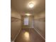 Large walk-in closet with double hanging rods and window at 302 Glenview Ln, Durham, NC 27703