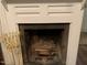 Traditional brick fireplace with a rustic mantel at 322 Mccauley St, Chapel Hill, NC 27516