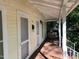 Inviting front porch with double doors and a bench at 322 Mccauley St, Chapel Hill, NC 27516
