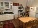 White kitchen with wood table and plenty of storage at 322 Mccauley St, Chapel Hill, NC 27516