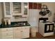 Bright kitchen with white cabinets and green countertops at 322 Mccauley St, Chapel Hill, NC 27516