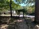 Stone path leads to a charming pergola entrance at 322 Mccauley St, Chapel Hill, NC 27516