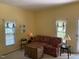 Cozy living room featuring a floral sofa and wicker coffee table at 322 Mccauley St, Chapel Hill, NC 27516