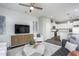 Open living room with modern decor and view into kitchen and dining area at 365 Fosterton Cottage Way, Raleigh, NC 27603