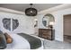 Spacious bedroom with wood dresser and large mirror at 371 Fosterton Cottage Way, Raleigh, NC 27603