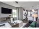 Living area with open concept layout and kitchen view at 371 Fosterton Cottage Way, Raleigh, NC 27603