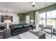 Spacious living room with green accent wall and comfortable seating at 371 Fosterton Cottage Way, Raleigh, NC 27603