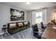 Home office with a green couch and wooden desk at 371 Fosterton Cottage Way, Raleigh, NC 27603