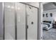 Walk-in shower with glass enclosure and tiled walls at 371 Fosterton Cottage Way, Raleigh, NC 27603