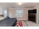 Comfortable bedroom with king-size bed and TV at 516 Argyll Dr, Sanford, NC 27332