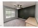 Bright bedroom with a ceiling fan and large window at 516 Argyll Dr, Sanford, NC 27332