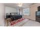 Spacious bedroom with king-size bed and patterned rug at 516 Argyll Dr, Sanford, NC 27332
