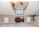 Bonus room featuring a window, ceiling fan, and ample space at 516 Argyll Dr, Sanford, NC 27332