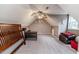 Spacious bonus room with window, ceiling fan, and hardwood floors at 516 Argyll Dr, Sanford, NC 27332