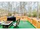 Deck overlooking wooded area, with grill and seating at 516 Argyll Dr, Sanford, NC 27332