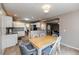 Bright dining area with wooden table and chairs, near kitchen at 516 Argyll Dr, Sanford, NC 27332