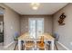 Dining area with wooden table and chairs, access to backyard at 516 Argyll Dr, Sanford, NC 27332