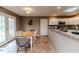Bright dining area with wooden table and chairs, adjacent to kitchen at 516 Argyll Dr, Sanford, NC 27332