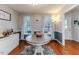Dining room with hardwood floors, round table, and window views at 516 Argyll Dr, Sanford, NC 27332