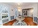Dining room with hardwood floors, round table, and window views at 516 Argyll Dr, Sanford, NC 27332
