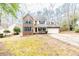 Brick two-story house with attached garage and landscaped lawn at 516 Argyll Dr, Sanford, NC 27332
