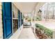 Side porch with a swing and lush green bushes at 516 Argyll Dr, Sanford, NC 27332