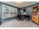 Home office with large window, desk, and built-in shelving at 516 Argyll Dr, Sanford, NC 27332