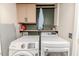 Laundry room with Samsung washer and dryer and storage cabinets at 516 Argyll Dr, Sanford, NC 27332