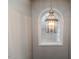 Elegant light fixture above an arched window at 516 Argyll Dr, Sanford, NC 27332