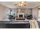 Living room with fireplace, comfortable seating, and large windows at 516 Argyll Dr, Sanford, NC 27332