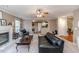 Open living room with fireplace and view to kitchen at 516 Argyll Dr, Sanford, NC 27332