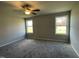 Spacious bedroom with neutral walls, carpet, ceiling fan and two windows at 57 Shiloh Dr, Lillington, NC 27546