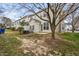 Small backyard with trees and patchy grass at 5734 Corbon Crest Ln, Raleigh, NC 27612