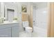 Light and airy bathroom with a light blue vanity at 5734 Corbon Crest Ln, Raleigh, NC 27612