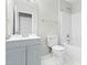 Clean bathroom with grey vanity and white toilet at 5734 Corbon Crest Ln, Raleigh, NC 27612