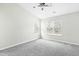 Bright bedroom with ceiling fan and gray carpeting at 5734 Corbon Crest Ln, Raleigh, NC 27612