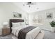 Bedroom with gray carpet, ceiling fan and stylish decor at 5734 Corbon Crest Ln, Raleigh, NC 27612