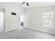 Bedroom with gray carpet, ceiling fan and access to bathroom at 5734 Corbon Crest Ln, Raleigh, NC 27612