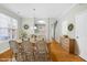 Charming dining room, hardwood floors, and farmhouse style table at 5734 Corbon Crest Ln, Raleigh, NC 27612