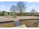playground with swings and play structure at 5734 Corbon Crest Ln, Raleigh, NC 27612