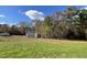 Large lot with grassy area, trees, and a shed at 59 Holly Grove Ln, Lillington, NC 27546