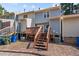 View of backyard with wooden stairs leading to a deck at 6548 English Oaks Dr, Raleigh, NC 27615