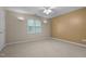 Bright bedroom with neutral walls, carpet, and ceiling fan at 6548 English Oaks Dr, Raleigh, NC 27615