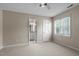 Bedroom with carpet, ceiling fan, and access to bathroom at 6548 English Oaks Dr, Raleigh, NC 27615