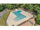 L-shaped community pool with lounge chairs at 6548 English Oaks Dr, Raleigh, NC 27615
